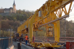 Track layer PKP 25/20 is a special bridge crane designed for laying and removing of 25 m long (and shorter) railway tracks on wooden or concrete sleepers and of maximum weight of 20 tons.