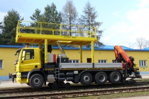 The vehicle is equipped with fixed platform, with loading capacity of 800 kg, used for installing of required equipment at heights as well as with hydraulic loading crane of 22tm capacity, which is located at the rear part of the vehicle and is designed to handle the load, or to work with a basket.